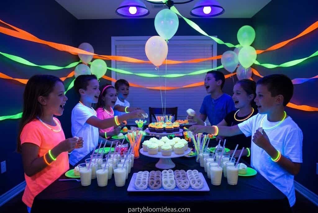 Glow-in-the-dark kids birthday party with neon balloons, UV lights, and glowing decorations