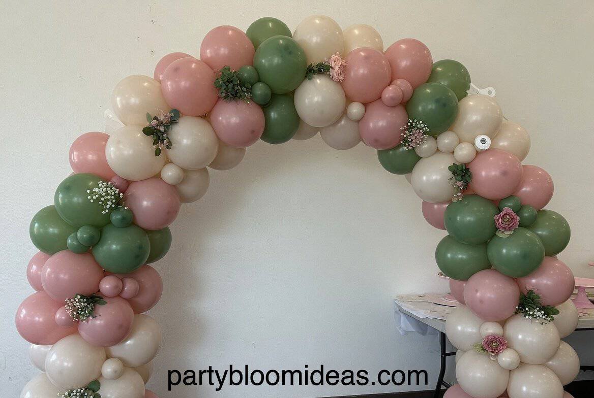 Colorful DIY balloon arch backdrop in pastel tones for party photo booth setup. A balloon arch is one of the most eye-catching DIY setups.