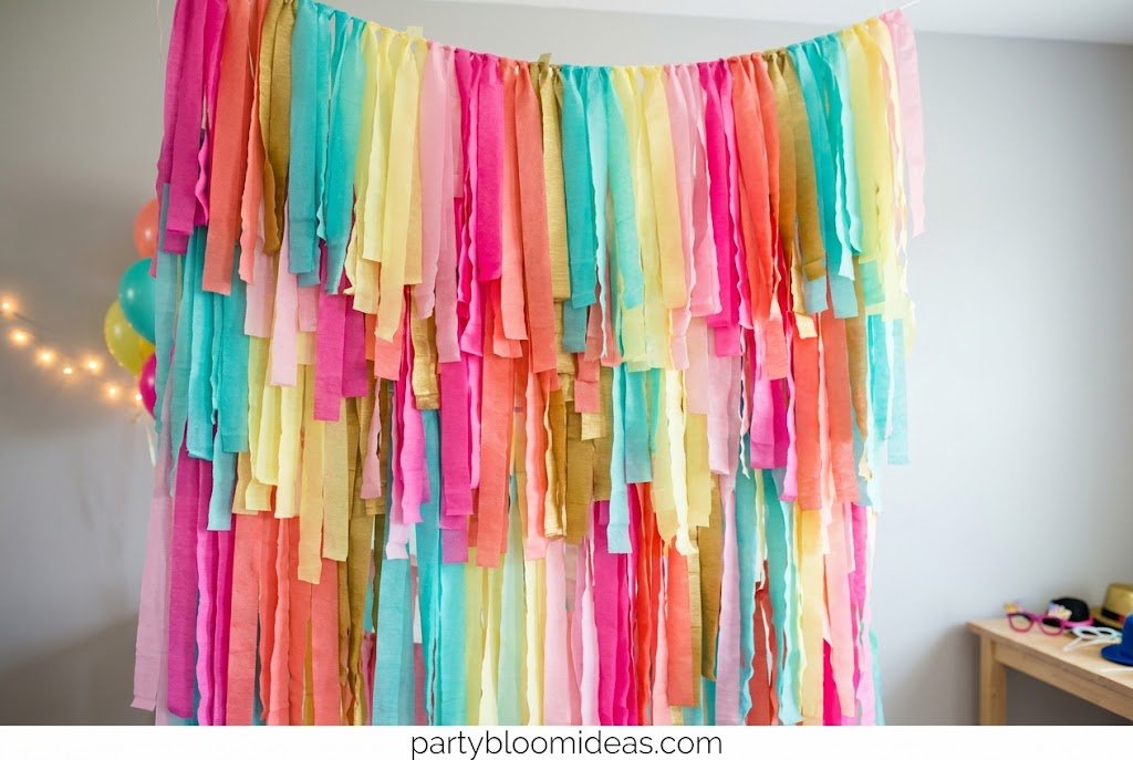 Metallic streamer fringe curtain DIY photo booth with shimmering gold strands, creating a fun and vibrant backdrop for graduations, proms, and party celebrations.