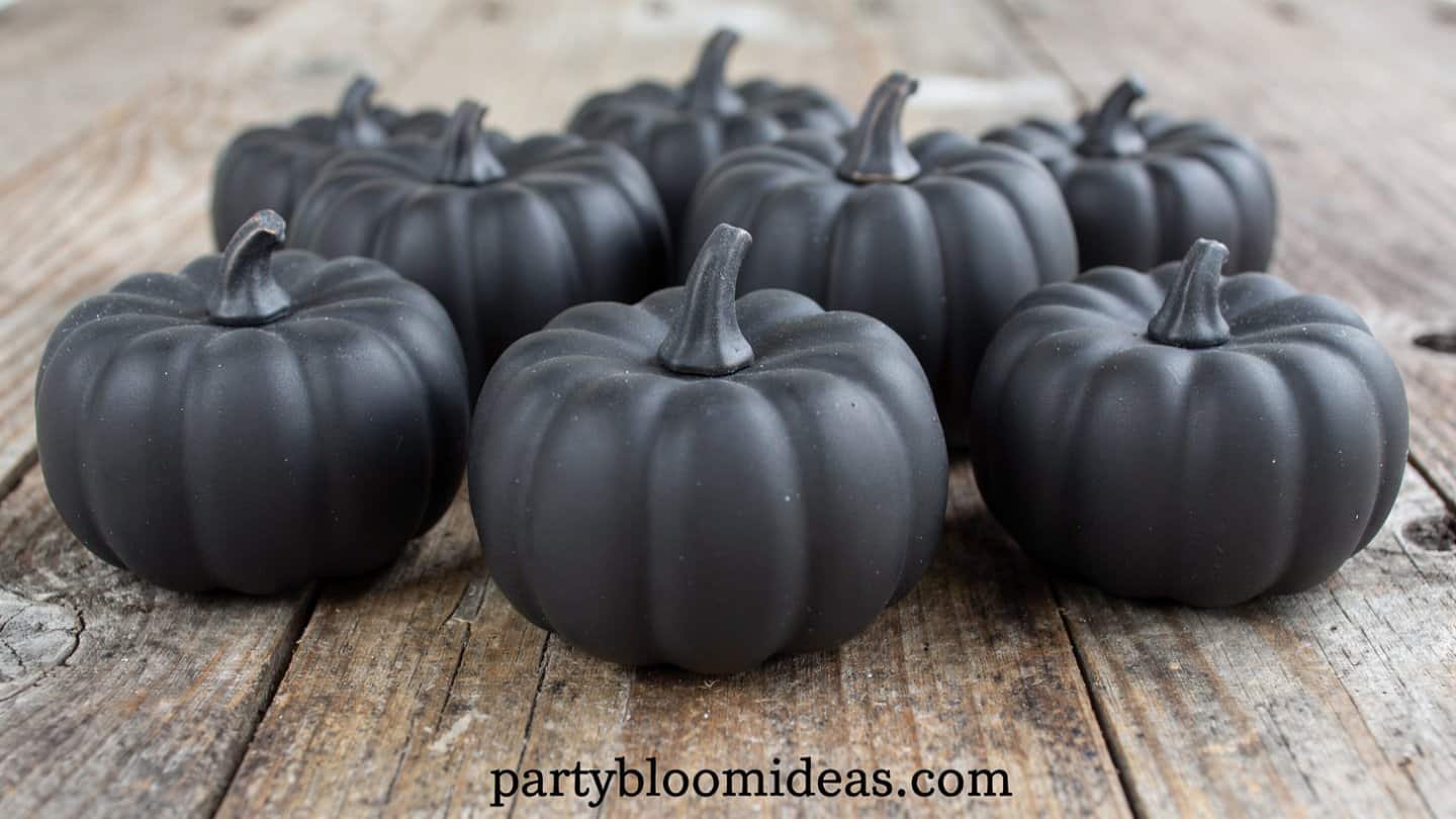 Chalkboard painted pumpkins with guest names for Thanksgiving table